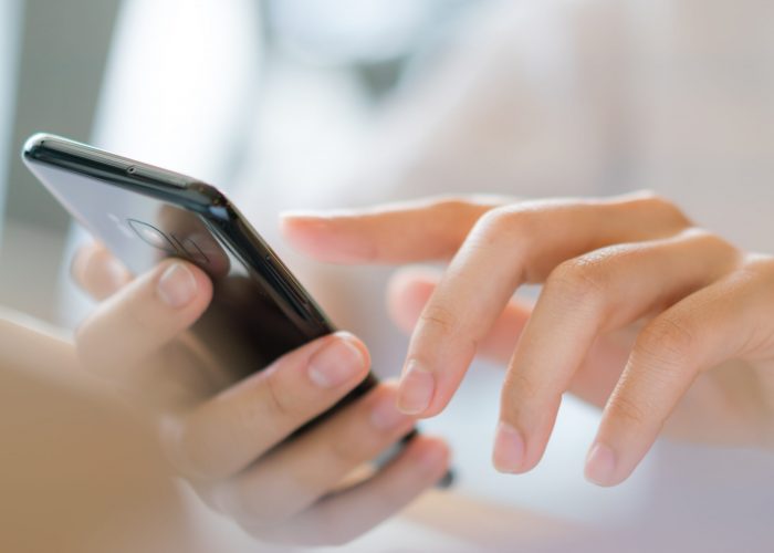 Business hand with mobile phone